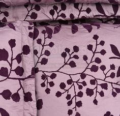 the comforter is made up with purple leaves