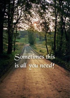 a dirt road with the words sometimes this is all you need