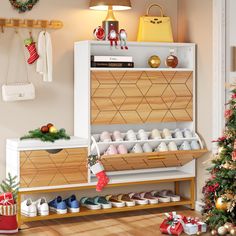 the shoe rack is filled with shoes and christmas decorations