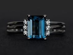 Welcome to my shop, you can find many beautiful gemstone jewelry here, and you also can ask for customized service. Main Stone: London blue topaz, emerald cut, measures 6X8mm, weight  about 2.0 caratsAccent Stones: czMetal: 925 sterling silver plated with rhodium. I also can provide metal options such as 14k solid yellow/white/rose goldSetting: four claw basket settingMore rings: https://www.etsy.com/shop/XCjewelryStudio?ref=hdr_shop_menuIt's a perfect gift for the person who was born in Novembe Blue Topaz Ring Engagement, Topaz Ring Engagement, London Blue Topaz Jewelry, Blue Topaz Ring Silver, Engagement Ring Blue, Blue Gemstone Ring, November Birthstone Ring, Blue Engagement Ring, Blue Topaz Engagement Ring