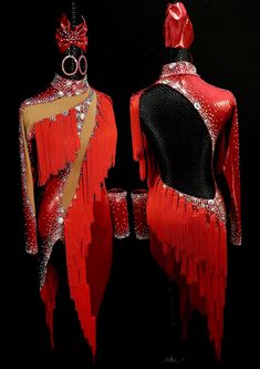 two mannequins dressed in red and gold with sequins on them