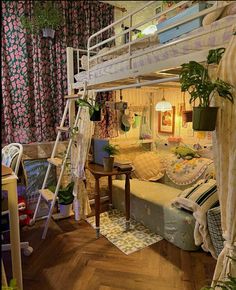 a room with bunk beds and plants in it