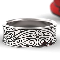 This completely unique octopus ring with Norse theme is stunning, and is perfect for him or her! It is detailed with an octopus on an intricate Norse motif and the delicate engraving pops with contrast. We offer different Finishing options. The finish used in the photos is the polished with patina. Please choose from the drop down menu. All our Celtic rings are made to order, and made in your size, WE --NEED-- YOUR SIZE BEFORE WE CAN MAKE YOUR RING. Our rings are available in 1/4 sizes from size Symbolic Engraved Ring With Intricate Design, Ornate Ceremonial Rings With Decorative Band, Ceremonial Ornate Rings With Decorative Band, Ornate Promise Ring, Ornate Engraved Ring For Ceremonial Occasions, Ceremonial Sterling Silver Engraved Ring With Intricate Design, Ornate Ceremonial Engraved Rings, Symbolic White Gold Engraved Ring, Symbolic Engraved Ring With Intricate Design For Anniversary