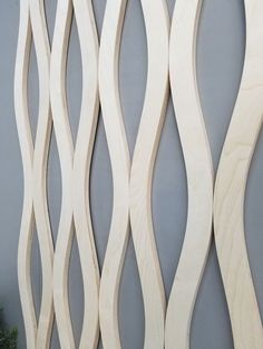 the wooden wall is made up of wavy lines and curves on it's sides