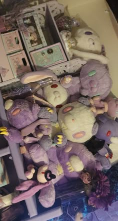 a pile of stuffed animals sitting on top of a table