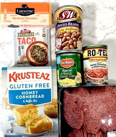 some meats and other food items on a counter