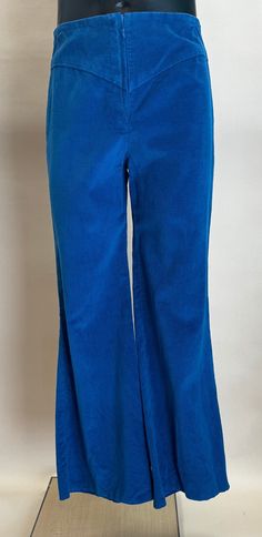 Get you groove on with these bright blue thin wale corduroy pants.  I believe that these pants were hand made. They are high waist with flared legs and close with a 6" front zipper and snap.  There are a few blemishes in the fabric (see photo). The color is still very vivid with out any fading.  This item is in good vintage condition.  Measurements: Waist:  29"  (measured flat then doubled) Hip:  36"   (measured flat then doubled) Front Rise:  12" Inseam: 28" Leg Opening:  22"  (measured flat th Corduroy Pants, Flare Pants, Bright Blue, Trousers Women, Front Zipper, Wales, Favorite Outfit, Capri Pants, Hand Made