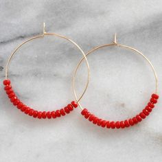 Think of these semi precious beaded hoop earrings as Libby & Smee Deluxe! Quite simply, these'll be the hoops that you'll want to wear every single day. Plus the gemstones all offer a little woo-woo — if that's your thing! 45mm (about 1.75") gold-filled or sterling silver hoops with gemstone beads packaged on a kraft earring card in a clear resealing bag gold-filled hoops are lead-free gold over brass. Gold-filled has much more gold than gold-plated and will last longer without tarnishing. E Gemstone Hoop Earrings, Earring Card, Gold Filled Hoops, Coral And Gold, Earring Cards, Wire Crafts, Beaded Hoop Earrings, Sterling Silver Hoops, Pink Opal