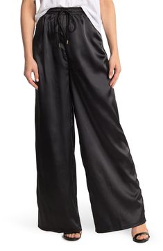 A pair of high waist, wide leg pants that feature a satin construction Elastic drawstring waist High rise Wide leg Solid Satin construction 97% polyester, 3% spandex Machine wash cold, tumble dry low Imported Model stats: 5'10", 32" bust, 25" waist, 36" hip. Model is wearing size S. High Waist Wide Leg Pants, High Waisted Pants, Drawstring Waist, Leg Pants, Wide Leg Pants, Nordstrom Rack, Harem Pants, High Waist, Wide Leg