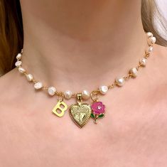 Are you looking for the perfect pearl locket necklace for someone special this gifting season? Or a unique personalized locket necklace to spoil yourself? Made with freshwater pearls, stainless steel findings and delicate rose charms, my vintage-style gold heart locket necklace is the perfect compliment to any outfit idea! My custom initial necklace is a great gift idea for any special occasion to all the women in your life. You can't go wrong when gifting my freshwater pearl necklace to your be Gift Pearl Charm Initial Pendant Necklace, Gift Pearl Charm Initial Pendant Necklaces, Mother's Day Pearl Necklace With Pearl Charm As Gift, Initial Pendant Pearl Chain Jewelry For Gift, Pearl Charm Jewelry With Initial Pendant, Initial Pendant Pearl Chain Jewelry As Gift, Pearl Chain Jewelry With Initial Pendant As Gift, Heart-shaped Pearl Charm Necklace Gift, Pearl Necklace With Initial Pendant As Gift