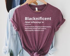 "Blacknificent Shirt, Black Women Gifts, Independent Black Women Shirt, Blacknificent Definition T-Shirt, Black Mom Gift, Women T-Shirts This is Moko Shirt! -Don't forget to see all the photos in listings for details like print color options and sizes and shirt colors. -Use the drop-down menus to notify the sizes and colors of your shirts. -Prices vary depend on the shirt sizes. -Shirts are soft and regular relax fit. Below there are some information about my products and shop. -Shirt Material: Women Gifts, Family Events, Women T Shirts, Women Shirt, Shirt Price, Mom Gift, Black Shirt, Color Options, Don't Forget