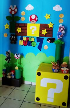 a room decorated in mario bros theme with decorations on the walls and around the area