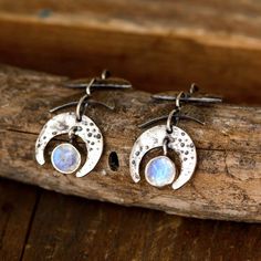 Bring the beauty of the night sky to your ears with these moon phase earrings. Made with Moonstone gems that symbolize the different phases of the moon. The elegant drop design adds a touch of sophistication to your look, while the iridescent moonstones catch the light beautifully. Experience the magic of the moon on your ears. Made of sterling silver.*Our jewelry features natural, genuine gemstones, ensuring each piece is unique and one-of-a-kind. Please note that, as no two gemstones are ident Moonstone Drop Earrings, Moonstone Ring Sterling Silver, Phases Of The Moon, Drop Design, The Night Sky, Unique Gemstones, Drops Design, Earrings Sterling Silver, Turquoise Gemstone