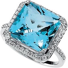 a ring with an aqua blue topazte surrounded by white cubicnes and diamonds