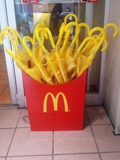 a mcdonald's box filled with yellow umbrellas