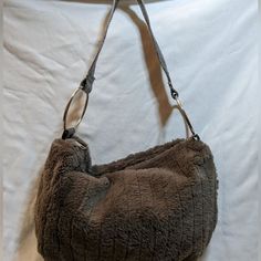 This Charming Charlie Grey Faux Fur Bag Is A Stylish Light Weight Shoulder Bag. This Is A New Bag With Tags And Has Two Open Drop Pockets And A Zip Pocket On The Inside And Plenty Of Room For Quick And Easy Storage Of All Your Items. The Bag Is In Very Good Condition But Does Have A Very Small Snag On The Strap By The Ring As Seen In The Photo. The Bag Measures 13" X 9" And An 8" Drop. Chic Travel Shoulder Bag With Faux Fur Lining, Chic Shoulder Bag With Faux Fur Lining, Shoulder Bag With Faux Fur Lining, Chic Everyday Shoulder Bag With Faux Fur Lining, Daily Use Shoulder Bag With Faux Fur Lining, Brown Shopping Bag With Faux Fur Lining, Brown Bag With Faux Fur Lining For Shopping, Brown Shoulder Bag With Faux Fur Lining, Chic Brown Bag With Faux Fur Lining