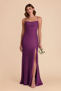 a woman in a purple dress with her legs slited up and holding a bouquet