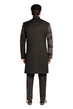 Black sherwani featuring bead and cutdana placement embroidery. Paired with a kurta and a churidar. - Aza Fashions Transitional Black Sherwani With Cutdana, Ceremonial Black Sherwani With Cutdana, Designer Black Nehru Jacket With Chikankari Embroidery, Black Sherwani With Cutdana For Formal Occasions, Designer Black Sherwani With Chikankari Embroidery, Black Bandhgala With Chikankari Embroidery For Transitional Season, Black Sherwani With Mirror Work In Traditional Drape, Black Sherwani With Mirror Work For Diwali, Black Sherwani With Cutdana For Eid