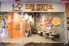 the front entrance to bark central dog park and cafe, which is open for business