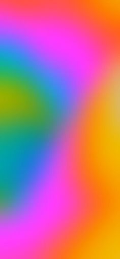 a blurry image of an orange, yellow and blue background with some colors in it