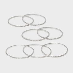 Get ready for any occasion with this 7-Piece Clear Glass Stone Stretch Bracelet Set from A New Day™. Designed with stretch and made from silver-tone metal, this accessory set includes seven bracelets embellished with faceted clear glass stones for a stunning look. You can wear one bracelet on its own or stack them together for a pop of layered style. A New Day™: Style that goes wherever you do. Silver Stackable Stretch Bracelet For Parties, Faceted Design, Layered Style, Stone Bangle, Silver Bangle Bracelets, Beaded Stretch Bracelet, Stretch Bracelet, A New Day, Beaded Chain