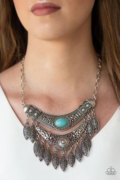 Featuring a collision of hammered, studded, and embossed patterns, two silver half-moon plates dramatically stack below the collar. Swirling with studded filigree detail, ornate silver frames swing from the bottoms of the stacked pendants, creating a fierce tribal inspired fringe. A refreshing turquoise stone is pressed into the center of the uppermost frame for a seasonal finish. Features an adjustable clasp closure.   Sold as one individual necklace. Includes one pair of matching earrings. Blue Stone Necklace, Filigree Necklaces, Silver Frames, Fringe Necklace, Paparazzi Accessories, Paparazzi Jewelry, Blue Necklace, Short Necklace, Silver Filigree