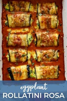 eggplant rollatini in a white casserole dish with tomato sauce