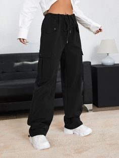 Effortlessly embodying the spirit of contemporary fashion, these Drawstring Waist Plain Parachute Pants are an exquisite blend of comfort and elegance. Crafted with meticulous attention to detail, these pants boast a sophisticated silhouette that effortlessly elevates any ensemble. The absence of embellishments and patterns lends a timeless appeal, making them a staple piece in any discerning fashion enthusiast's wardrobe. Specifications: Style: Casual Pattern Type: Plain Type: Parachute Pants C Black Wide Leg Drawstring Pants, Black Drawstring Pants For Work, Chic Black Pants With Drawstring, Chic Black Drawstring Pants, Trendy Denim, Casual Denim, Staple Pieces, Contemporary Fashion, The Spirit