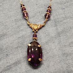 Absolutely Beautiful Deep Purple And Gold Necklace Featuring A Large Pendant Handmade In Rhode Island Every Piece Is Unique As It Is Made With Vintage Glass Never Worn, In Box Formal Purple Amethyst Necklace, Purple Oval Jewelry For Party, Formal Purple Pendant Necklace, Purple Oval Party Jewelry, Purple Pendant Jewelry For Party, Antique Oval Purple Necklaces, Antique Purple Oval Necklaces, Vintage Amethyst Purple Jewelry, Vintage Purple Amethyst Jewelry