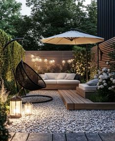 an outdoor seating area is lit up with lights