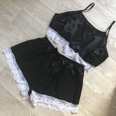 Black satin pyjamas with white lace trim Satin Sets With Lace Trim For Wedding Night, Satin Lace Trim Sets For Wedding Night, Sleepwear Sets With Lace Trim, Lace Sleepwear Sets With Lace Trim, Lace Sleep Sets With Lace Trim, Summer Night Satin Sets, Fitted Satin Night Sets, Lace Loungewear Sets With Lace Trim, Fitted Lace Trim Sleepwear Set