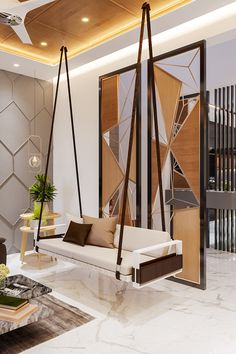 a living room filled with lots of furniture next to a wall covered in geometric designs