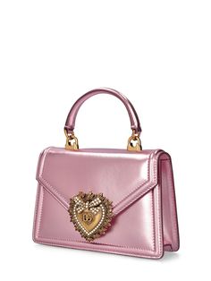 Height: 13cm Width: 19cm Depth: 4.5cm. Detachable strap. Single leather top handle. Front flap with snap button closure. Front metal buckle embellished with imitation pearls. One internal patch pocket. Leather lining Maximalist Shoes, Sleek Clothing, Boxy Bags, Stefano Gabbana, Pearl Studs, Handle Bag, Metallic Leather, Pink Leather, Metal Buckles