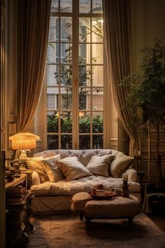 a living room filled with furniture and a large window