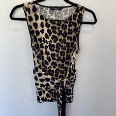 Nwot Zara Animal Print Crew Neck Sleeveless Top. Ties At Waist. Size Xs. Never Worn. Excellent Condition Fitted Leopard Print Cami Tank Top, Brown Sleeveless Tank Top For Night Out, Sleeveless Brown Tank Top For Night Out, Brown Sleeveless Top For Night Out, Sleeveless Brown Tops For Night Out, Stretch Sleeveless Leopard Print Top, Casual Leopard Print Sleeveless Tank Top, Fitted Sleeveless Brown Top, Casual Sleeveless Leopard Print Top