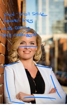 a woman leaning against a brick wall with her arms crossed and the words, he's small smile