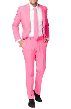 Formal style doesn't have to be rigid and boring. Thankfully, with this bright pink two-piece suit, OppoSuit goes against the grain with fun, bold personality. Tailored for a modern fit, it includes a two-button suit jacket and trousers cleanly styled with tonal buttons and stitching, as well as a matching tie to pull the whole outfit together. Jacket has a two-button closure; notch lapels; nonfunctional four-button cuffs; chest pocket; front flap pockets; side vents. Trousers have a zip fly wit Mens Pink Pants, Real Men Wear Pink, Navy Blue Suspenders, Sweet 16 Outfits, Black Suit Men, Against The Grain, Pink Two Piece, Beige Suits, Dress Suits For Men