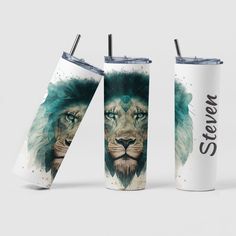 two travel mugs with the same design on them, one has an image of a lion