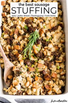 a casserole dish with stuffing in it and a wooden spoon on the side