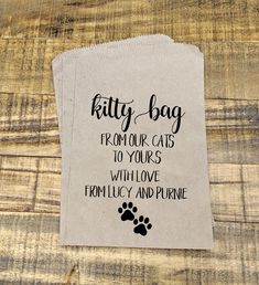 a piece of paper that says kitty bag from your cats to yours with love, family and pure