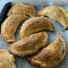 several pastries sitting on top of a baking pan