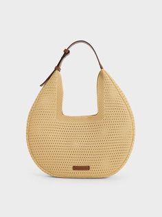 Beige Ida Knitted Hobo Bag | CHARLES & KEITH Modern Recyclable Shoulder Bag For Shopping, Modern Woven Bag In Natural Color, Modern Natural Woven Bags, Modern Beige Woven Straw Bag, Beige Recyclable Tote Shoulder Bag, Modern Beige Straw Bag, Eco-friendly Hobo Bag With Adjustable Strap, Modern Natural Crochet Bag For Everyday, Eco-friendly Woven Hobo Bag