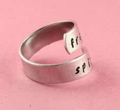 "Free Spirit Ring - Adjustable Ring - Twist Ring - Silver Ring - Peace Ring - Love Ring - Free Mind Ring - Custom Ring - Gift Under 20 Wonderful twist wrap ring handstamped with the words \"free spirit\"! Great gift for the friend who doesn't care what anyone thinks! Even though this is an adjustable ring, please choose your size at checkout so we can make it fit better. If you would like to order more than one, put one in your cart and choose the size, then add another into your cart and choose Peace Ring, Free Mind, Wrap Ring, Custom Ring, Twist Ring, Design Stamps, Wrap Rings, Love Ring, Adjustable Ring