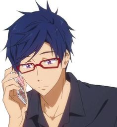 a man with glasses holding a cell phone to his ear and looking at the camera