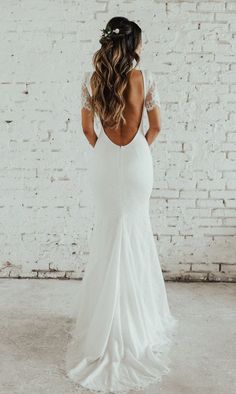 the back of a bride's wedding dress