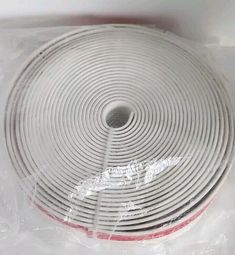 an image of a white cable wrapped in plastic