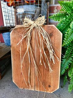 a piece of wood with some roots attached to it