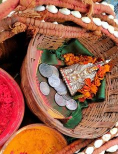 baskets filled with different colored powders and coins