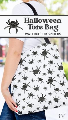 a woman carrying a black and white spider tote bag with text overlay that reads, halloween tote bag watercolor spiders