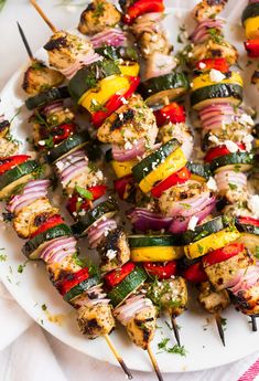 chicken kabobs on skewers with peppers and onions